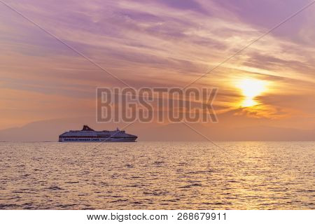 KEFALONIA, GREECE - OCTOBER 22, 2018: Minoan Lines High Speed Ferry Cruise Europa passing Kefalonia island at sunset