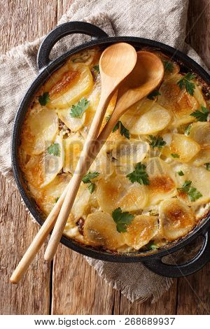 Finnish Cuisine Janssonin Kiusaus. Baked Potatoes With Anchovies, Onions And Cream Close-up In A Fry