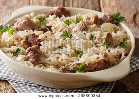 Mulgikapsas Estonian Food Slow-cooked Pork With Sauerkraut, Onions And Barley Closeup In A Dish. Hor
