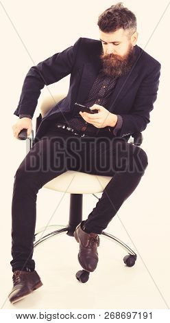 Serious Men Or Businessmen Using Mobile Or Cell Phone