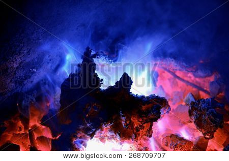 Background Consisting Of A Turquoise Flame From Burning Magnesium On A Hot Coal Anthracite.