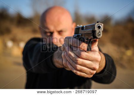 Time Sequence Of Man Pulls Out A Gun At Outdoor Shooting Range. Pistol And Weapons Training