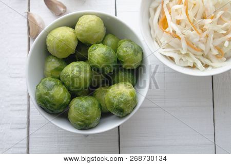 Two Kinds Jf Cabbage On A Wood Table