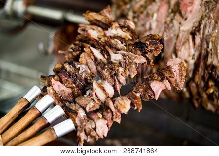 Turkish Cag Kebab Doner On Skewers In Wood Fired Oven.