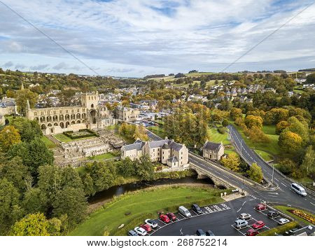 Aerial View Of Jedburgh In Autumn With The Ruins Of Jedburgh Abbey In Scotland