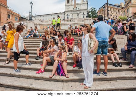 ROME - AUGUST 3: The Spanish Steps, with tourists, seen from Piazza di Spagna on August 3, 2018, Rome.The Spanish Steps are the widest staircase in Europe.