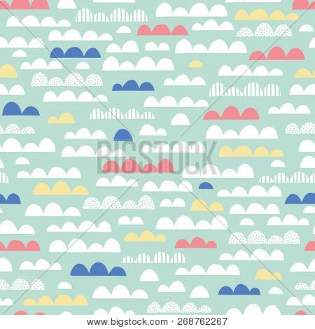 Cute Clouds Nursery Vector Seamless Pattern. Pink, Yellow, Blue And White Clouds On Mint Background.