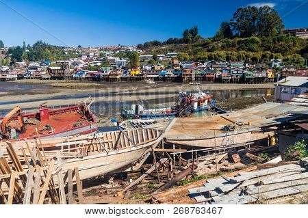 Fishing Boats And Palafitos Stilt Houses During Low Tide In Castro, Chiloe Island, Chile