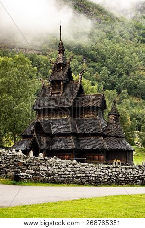 Borgund Stave Church (stavkyrkje) In Norway In Misty Cloudy Weather In A Portrait Orientation