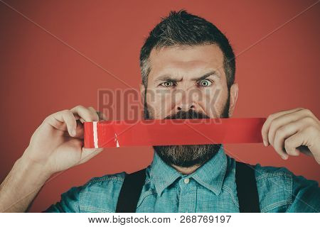 Man Wrapping Mouth By Adhesive Tape. Censorship. Brutal Bearded Male. Mind Control And Propaganda. I