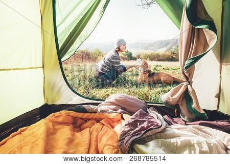 Woman Pand Her Dog Tender Scene Near The Camping Tent. Active Leisure, Traveling With Pet Concept Im