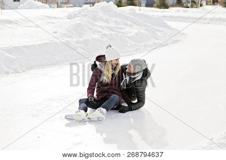 Couple In Sunny Winter Nature Ice Skating