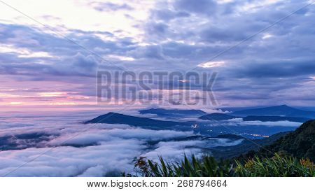 Beautiful Nature Landscape Of The Fog Covers The Summit And The Colorful Sky During Sunrise In The W