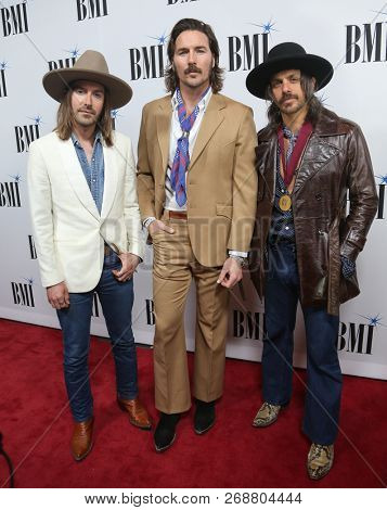NASHVILLE, TN - NOV 13: (L-R) Jess Carson, Mark Wystrach and Cameron Duddy of Midland attend the BMI Country Awards 2018 at BMI Nashville on November 13, 2018 in Nashville, Tennessee.