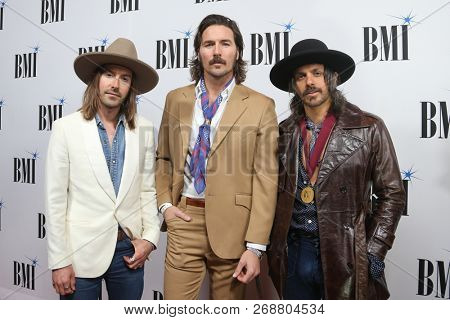 NASHVILLE, TN - NOV 13: (L-R) Jess Carson, Mark Wystrach and Cameron Duddy of Midland attend the BMI Country Awards 2018 at BMI Nashville on November 13, 2018 in Nashville, Tennessee.