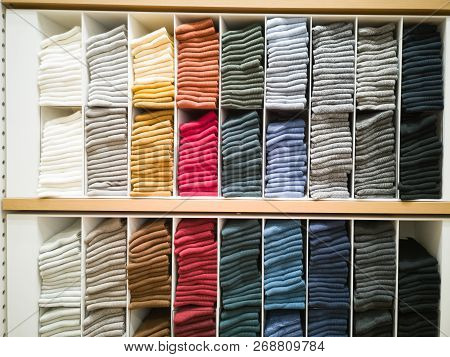 Cotton T-shirt Folded Neatly In The Showroom,colorful Clothes Folded In The Cabinet,colorful Clothes