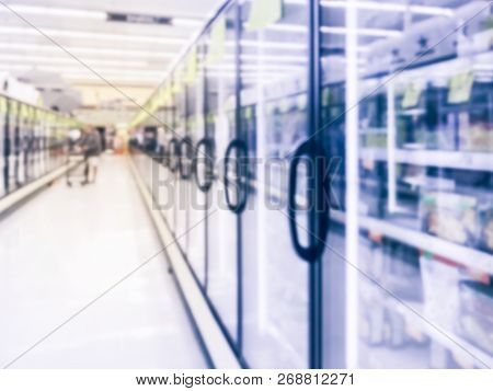 Blurry Background Customer Shopping For Frozen Food At Supermarket In America