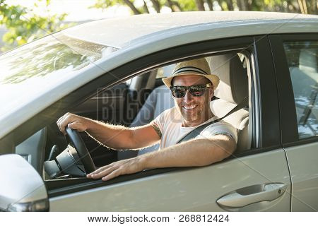 Men Sitting In A Rental Car On Holiday Vacancy