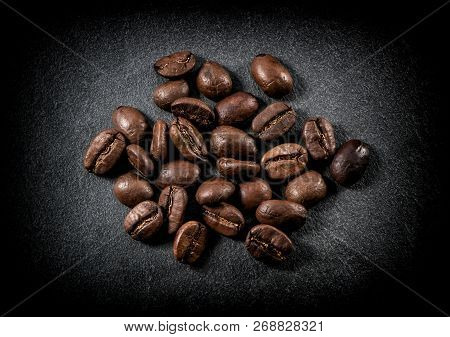 Roasted Coffee Beans Close-up On Black Background