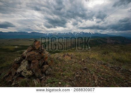 Summer in Kurai steppe and North-Chui ridge of Altai mountains, Russia. Cloud day.