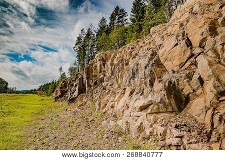 The Landscape Of Marble Canyon In Karelia. Mountains And Rocks Of Marble Canyon. Pines On The Edge O