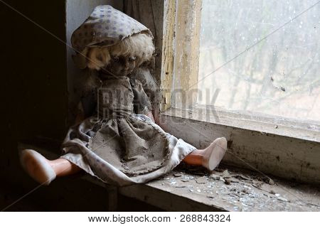 Doll On Windowsill In Abandoned Kindergarten In Destroyed Village Of Kopachi (10-km Chernobyl Npp Al
