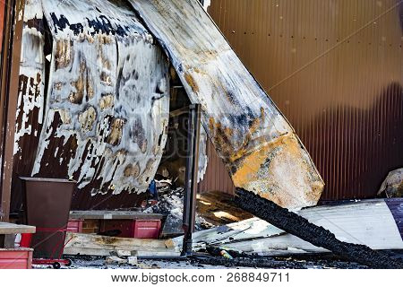 Damaged Industry Supermarket After Arson Fire With Burn Debris Of Twisted Metallic Wood Structure Af