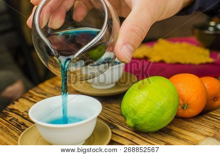 Organic Blue Tea Anchan In A Teapot And A Cups On Wooden Background