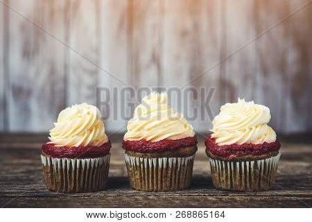 Tasty Cupcakes With Cream Cheese Frosting. Homemade Cupcakes On Rustic Wooden Board. Cupcakes For Pa