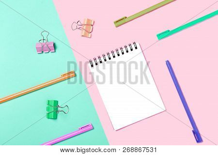 Empty Notebook Or Notepad On Pink And Blue Background. Creative Minimalism Chancery Concept. Top Vie