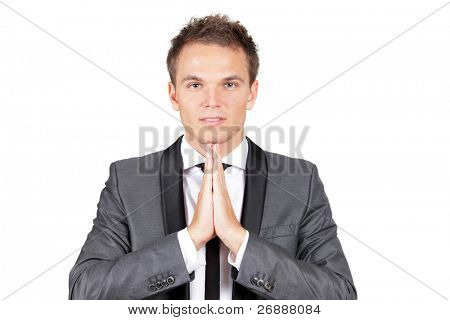 Bir dua yaparken şık beyaz işadamı