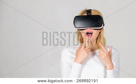 Amazed Young Woman Touching The Air During The Vr Experience. Beautiful Woman Wearing Virtual Realit