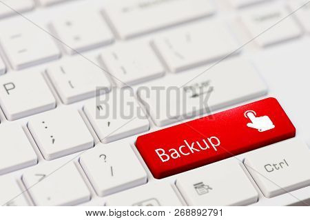 Red Key With Text Backup And Touch Finger Icon On White Laptop Keyboard.