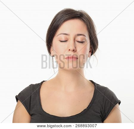 Young Elegant Woman Relaxing With Closing Eyes