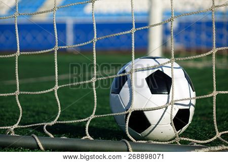 Football On A Green Field . Sport. The Ball In The Goal.