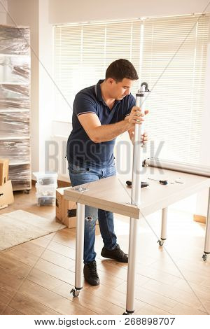 Man Assembly Furniture For New House They Purchased
