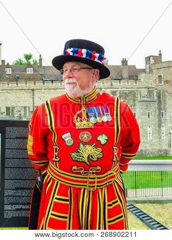 London, United Kingdom - June 10, 2013: Beefeater Near Walls Of The Tower Of London. Beefeaters Or Y