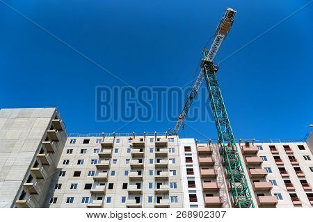 Modern Construction Site Of Building With Crane