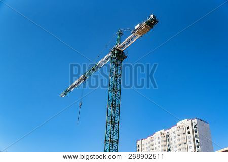 Modern Construction Site Of Building With Crane