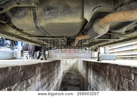Bottom View Of A Car. Forged Car For A Hundred. Car Repair. Car View From Below.