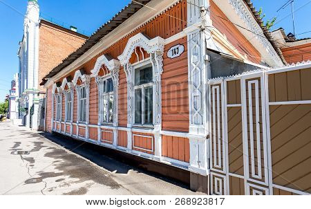 Samara, Russia - June 23, 2018: Old Wooden House With Carved Platbands On City Street. Vintage Tradi