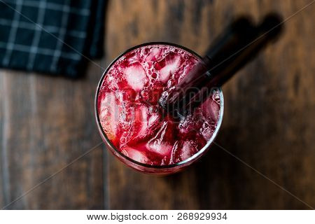 Alabama Slammer Cocktail With Black Straw.