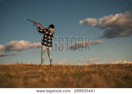 Process Of Duck Hunting. Hunter In The Fall Hunting Season. Hunter With Shotgun Gun On Hunt. Skeet S