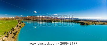 Lake Ruataniwha, New Zealand, South Island, trees and mountains, water reflections