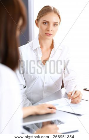 Group Of Business People Or Lawyers Discussing  Terms Of Transaction In Office. Colleagues Working A