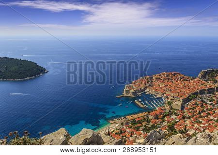 Dubrovnik Old Town Surrounded By Fortified Walls Above The Adriatic Sea, Croatia. Picturesque View O