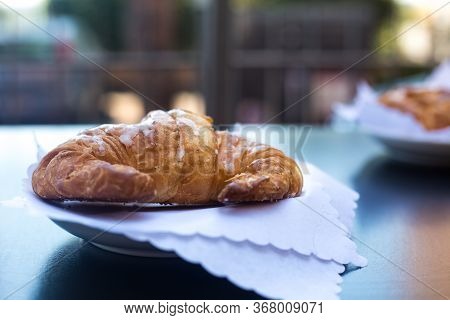 Italian Breakfast. Fresh Crunchy Croissant Or Cornetto Served In Outdoor Terrace On White Napkins Wi