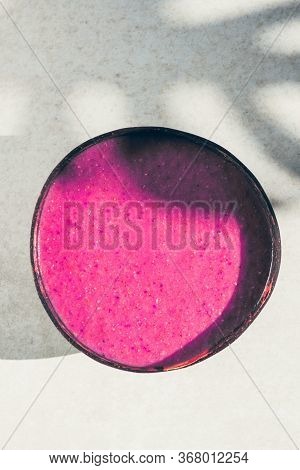 Pink Smoothie From Banana, Strawberries And Pint Matcha In The Coconut Shell Bowl, Strong Shadows. H
