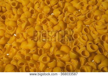 Composition Of Undigested Macaroni Pasta Made With Hard Light On A White Background.