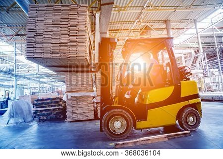Forklift Loader In Storage Warehouse Ship Yard. Distribution Products.